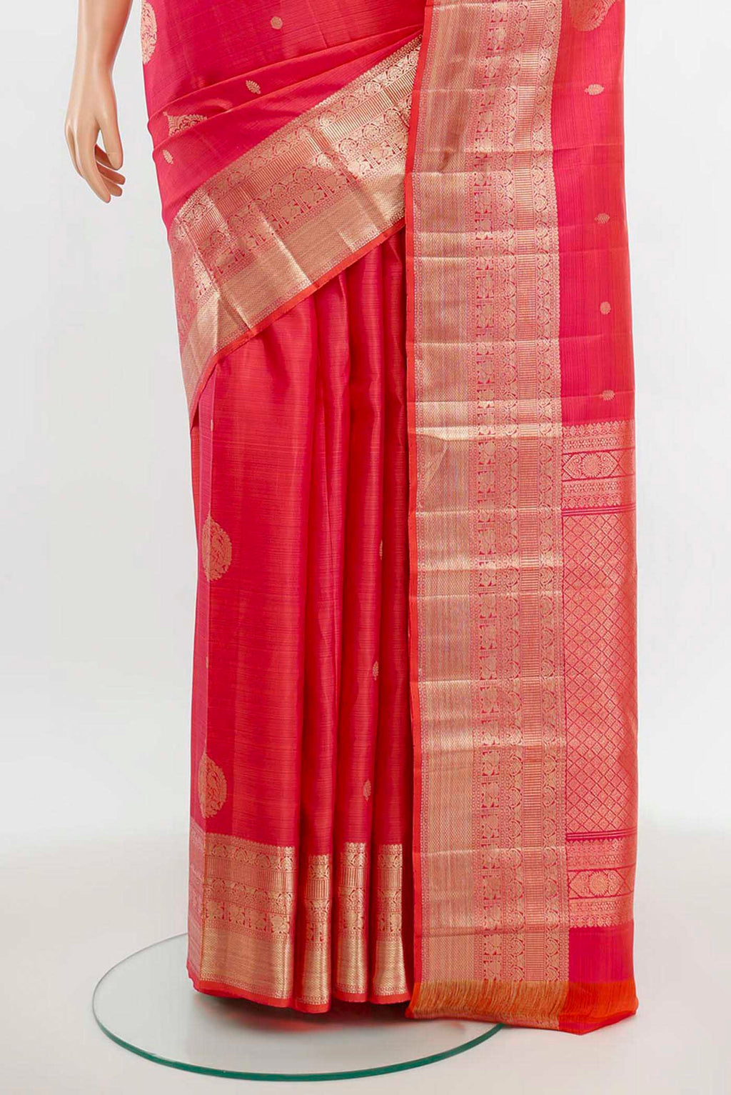 Pleats and pallu of Rose pink Kanjivaram Silk Saree with Zari Butta on the body and Silk Border. 