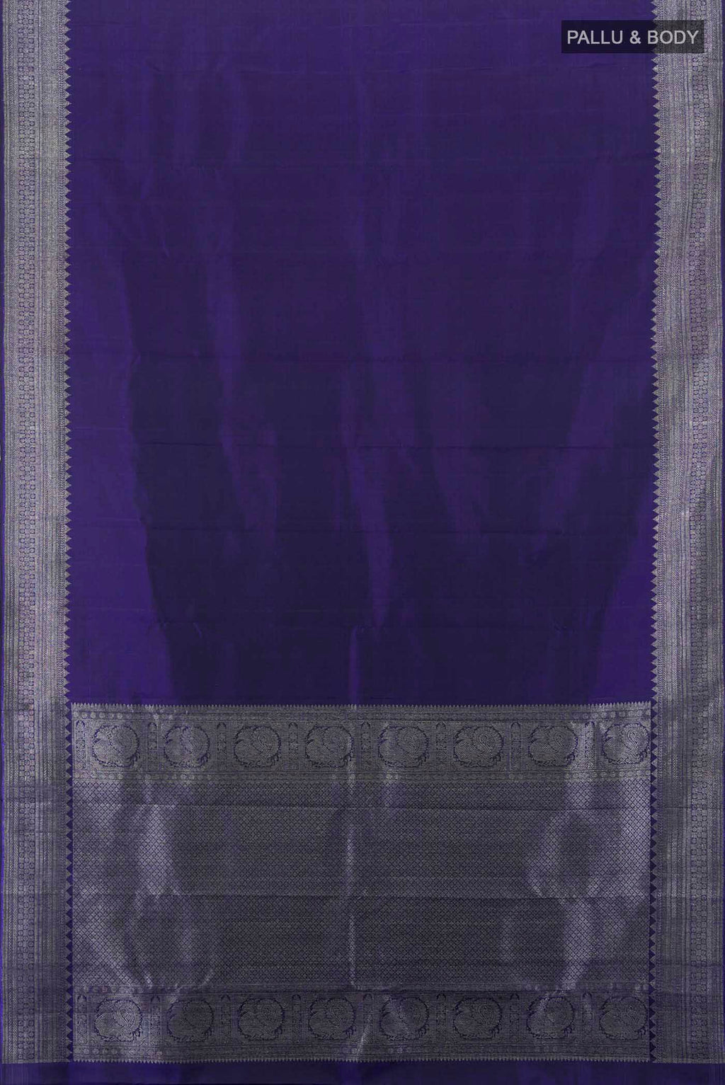 Flat view of Navy Blue Kanjivaram Silk Saree with Zari Butta on the body and Silk Border. 
