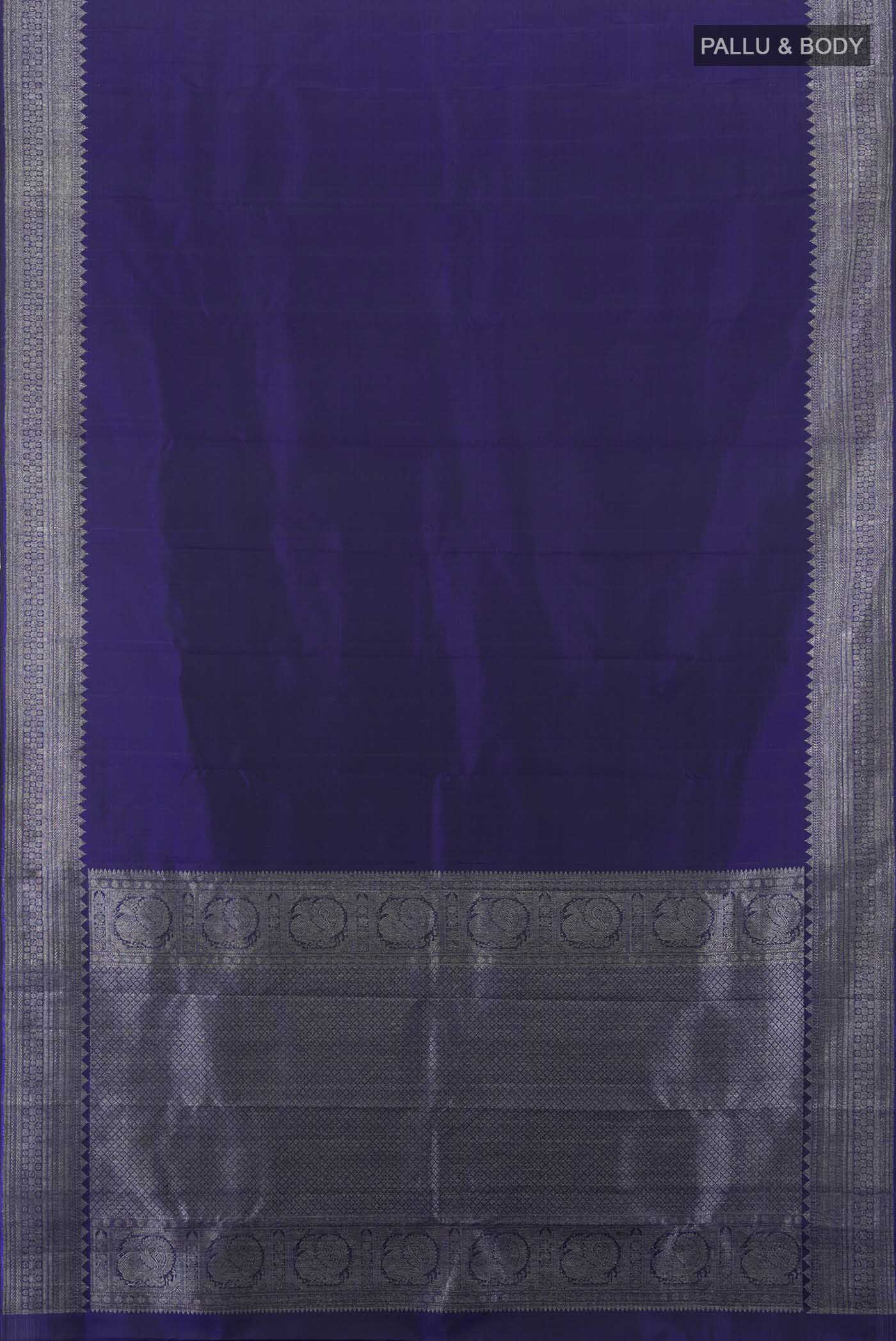 Flat view of Navy Blue Kanjivaram Silk Saree with Zari Butta on the body and Silk Border. 