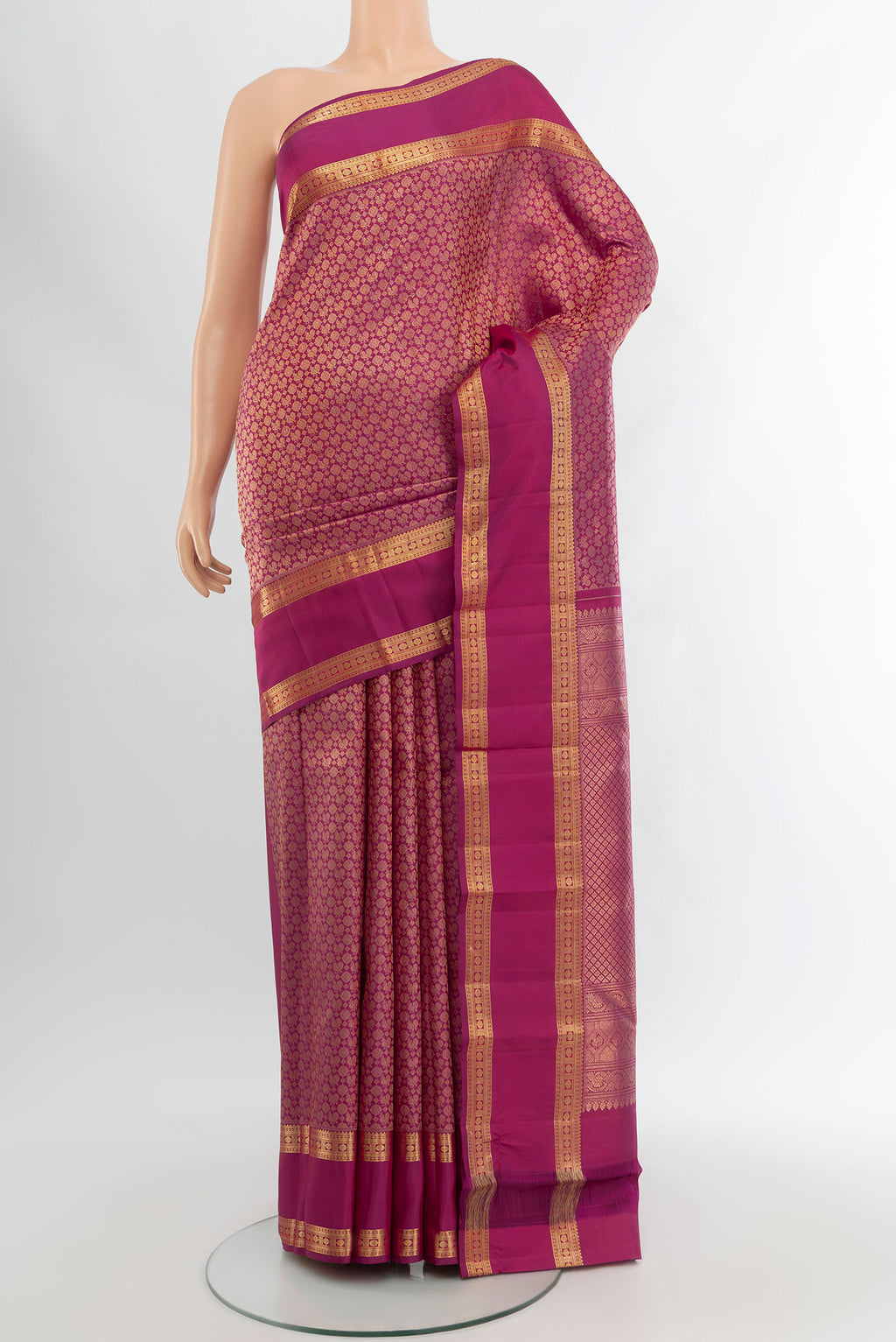 Magenta Kanchipuram Silk Saree with Zari Brocade on the body and Zari Border.  displayed on a mannequin