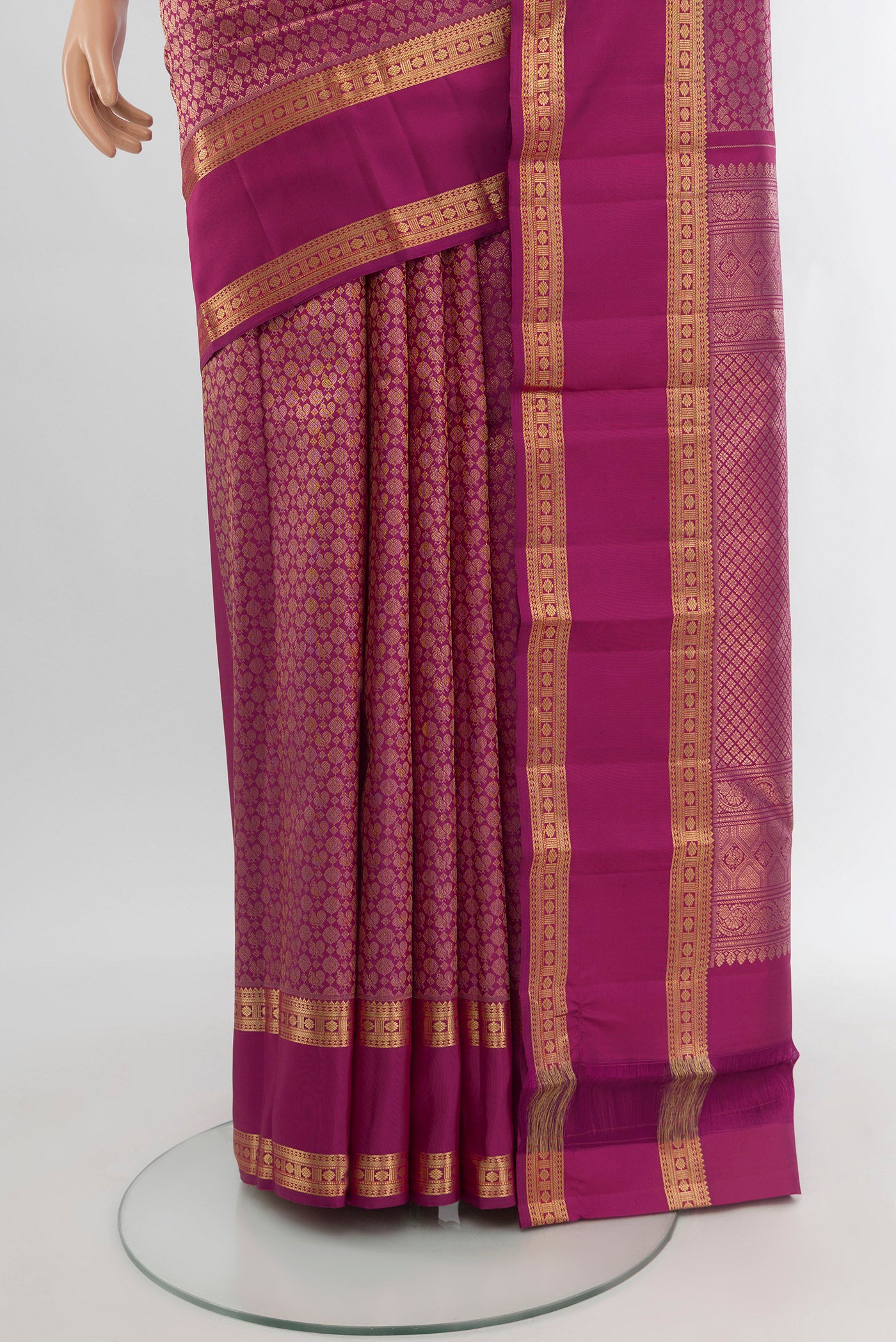 Pleats and pallu of Magenta Kanchipuram Silk Saree with Zari Brocade on the body and Zari Border. 