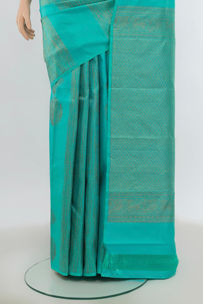 Pleats and pallu of Pure Silk Pure Zari Sea Green Kanchipuram Saree with Zari Butta on the body and Silk Border. 