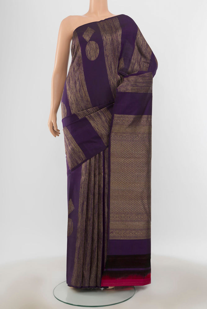 Pure Silk Pure Zari Violet Kanchipuram Saree with Zari Butta on the body and Silk Border.  displayed on a mannequin
