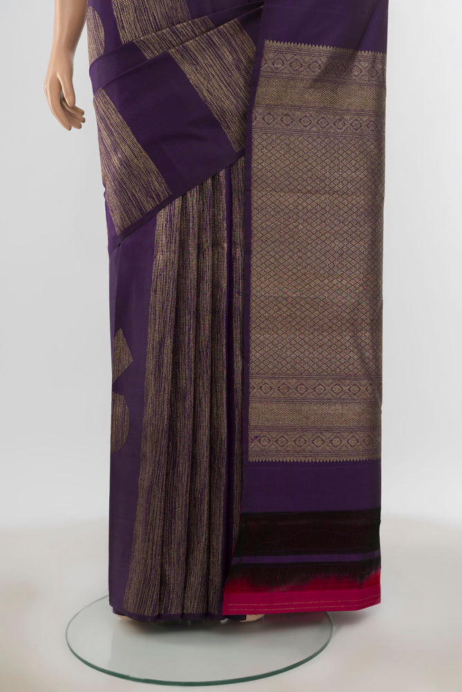 Pleats and pallu of Pure Silk Pure Zari Violet Kanchipuram Saree with Zari Butta on the body and Silk Border. 