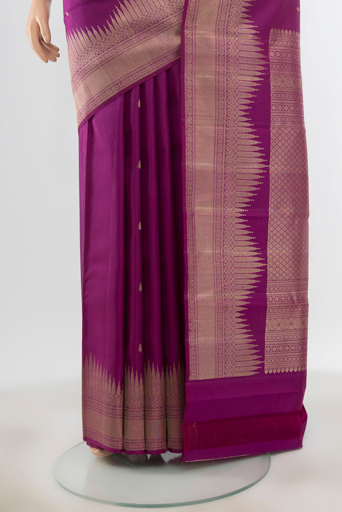 Pleats and pallu of Pure Silk Pure Zari Purple Kanjivaram Saree with Zari Butta on the body and Silk Border. 