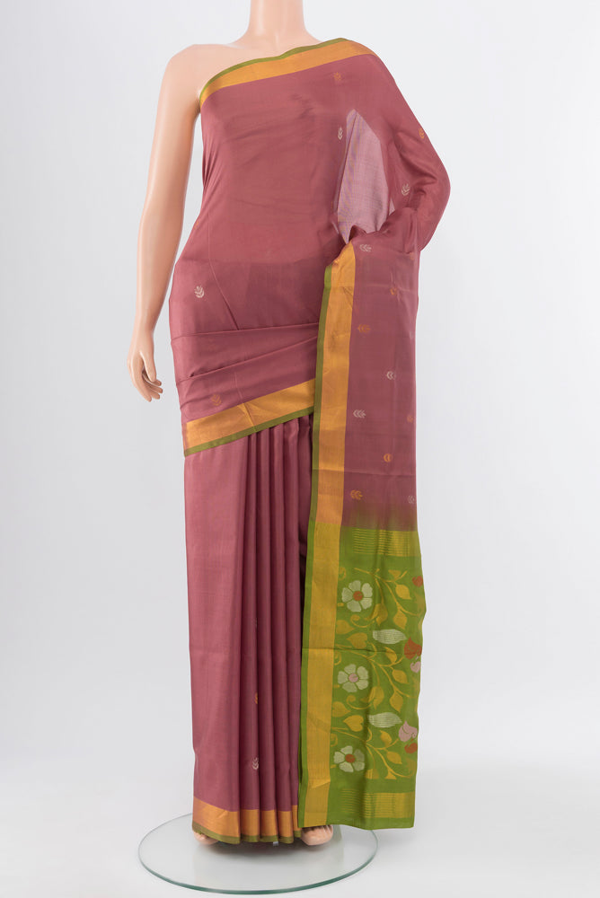 Pure Silk Pure Zari Bronze Soft Saree with Zari Butta on the body and Silk Border.  displayed on a mannequin