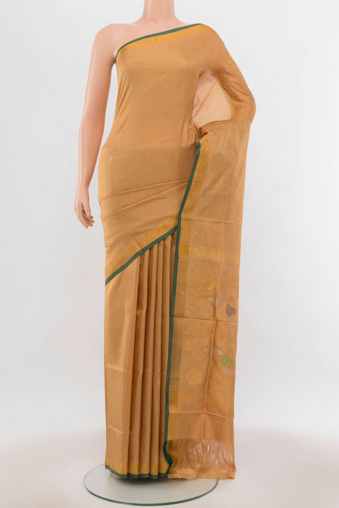 Beige Uppada Silk Saree with Zari Butta on the body and Silk Border.  displayed on a mannequin