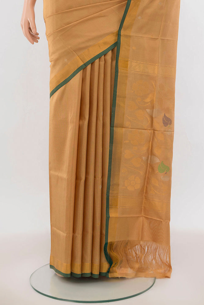 Pleats and pallu of Beige Uppada Silk Saree with Zari Butta on the body and Silk Border. 
