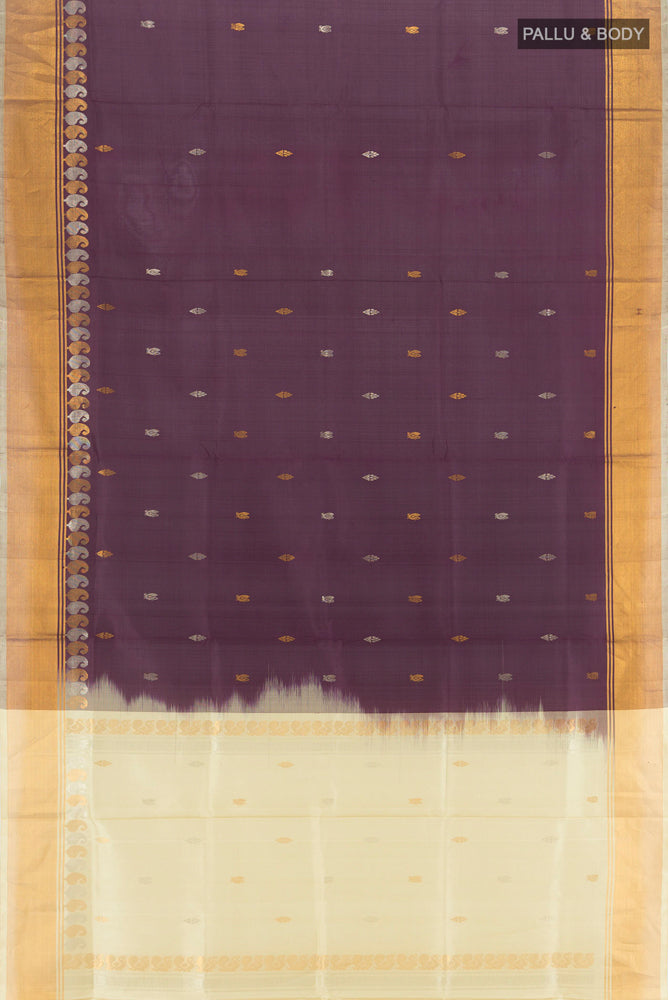 Flat view of Coffee Brown Uppada Silk Saree with Zari Butta on the body and Silk Border. 