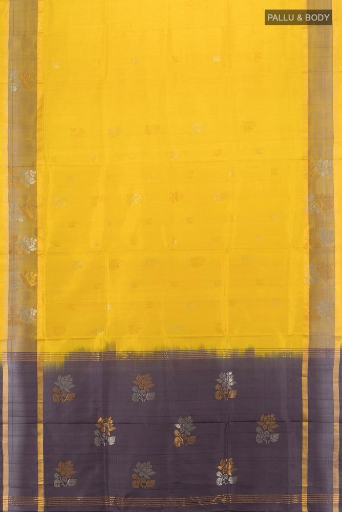 Flat view of Yellow Uppada Silk Saree with Zari Butta on the body and Silk Border. 