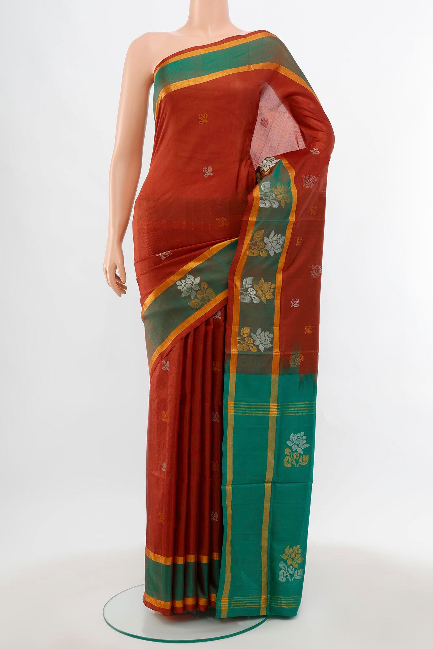 Brown Uppada Silk Saree with Zari Butta on the body and Silk Border.  displayed on a mannequin