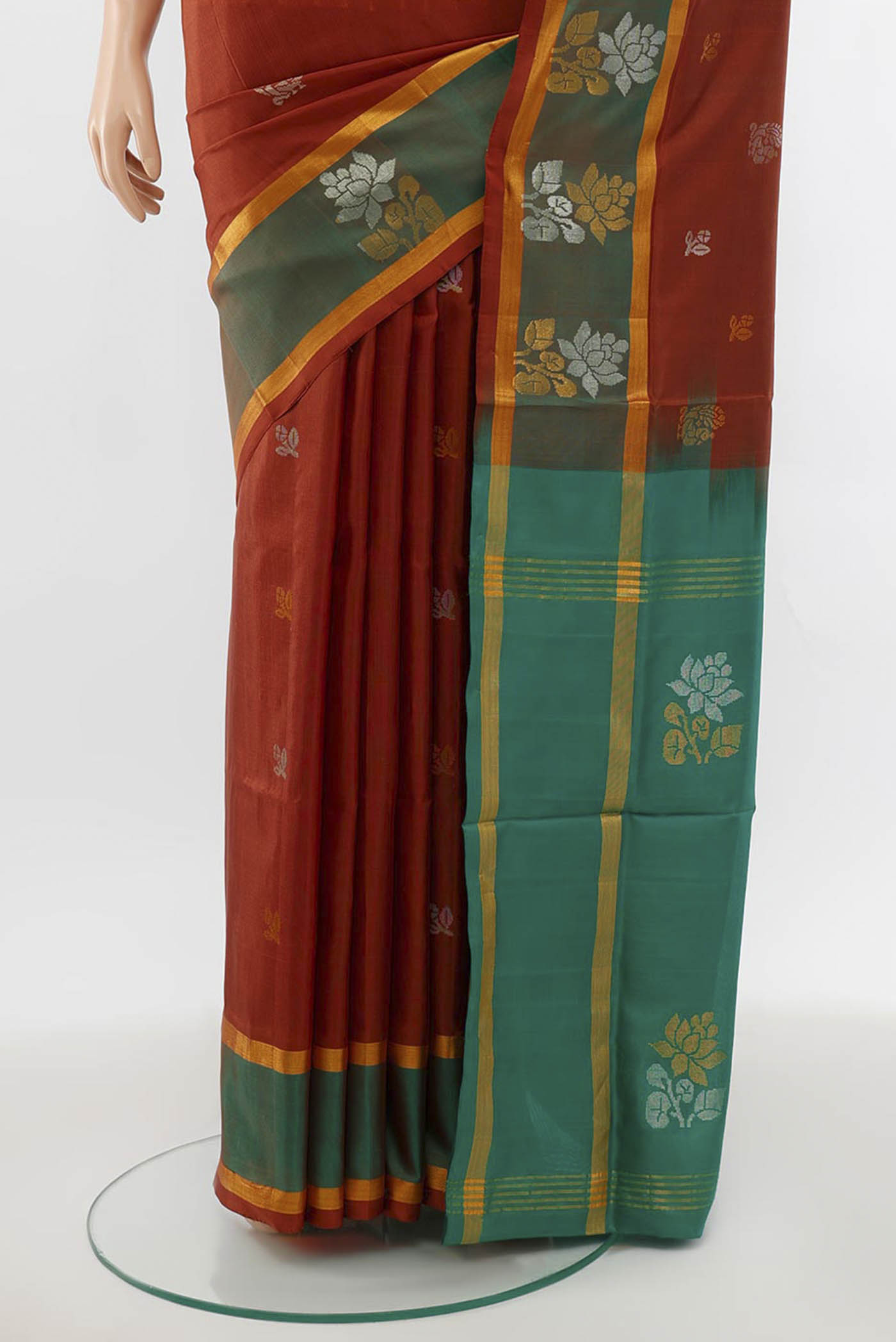 Pleats and pallu of Brown Uppada Silk Saree with Zari Butta on the body and Silk Border. 