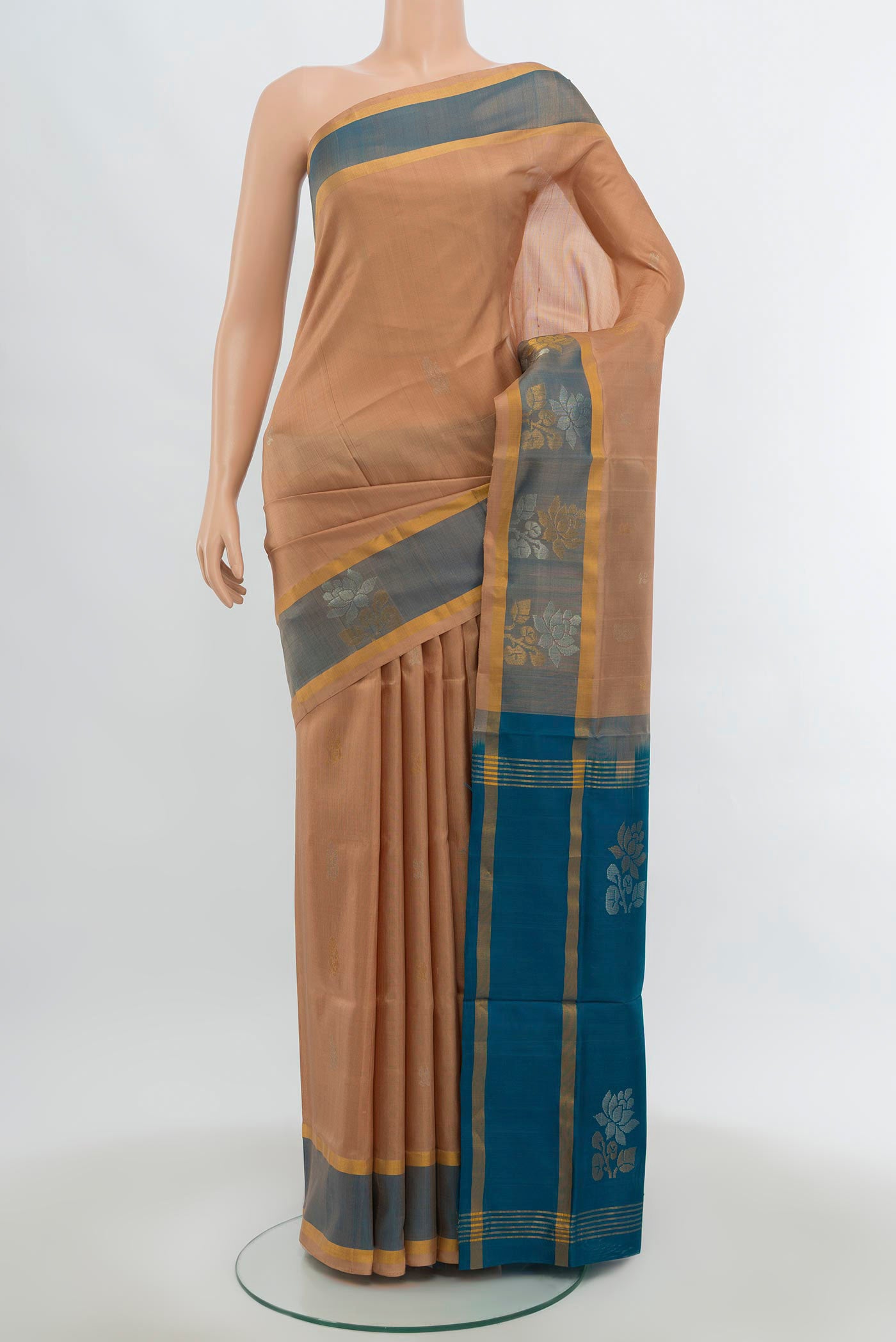 Beige Uppada Silk Saree with Zari Butta on the body and Silk Border.  displayed on a mannequin