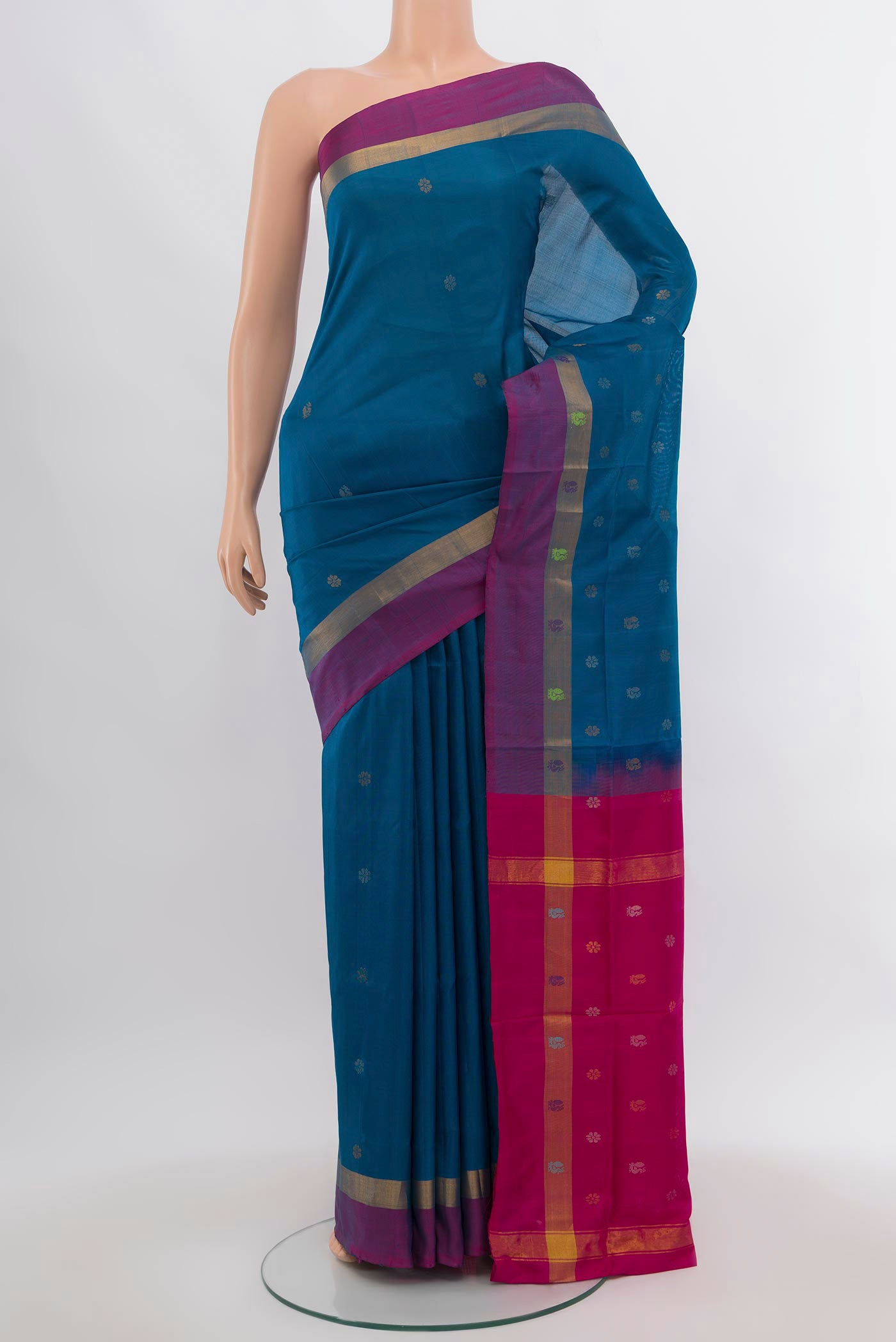 Dark Blue Uppada Silk Saree with Zari Butta on the body and Silk Border.  displayed on a mannequin