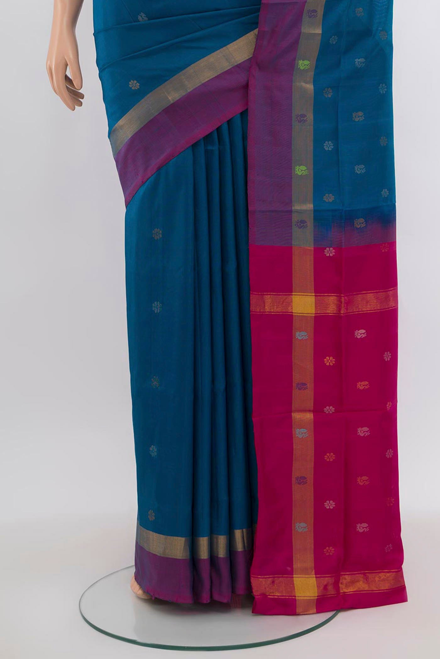 Pleats and pallu of Dark Blue Uppada Silk Saree with Zari Butta on the body and Silk Border. 