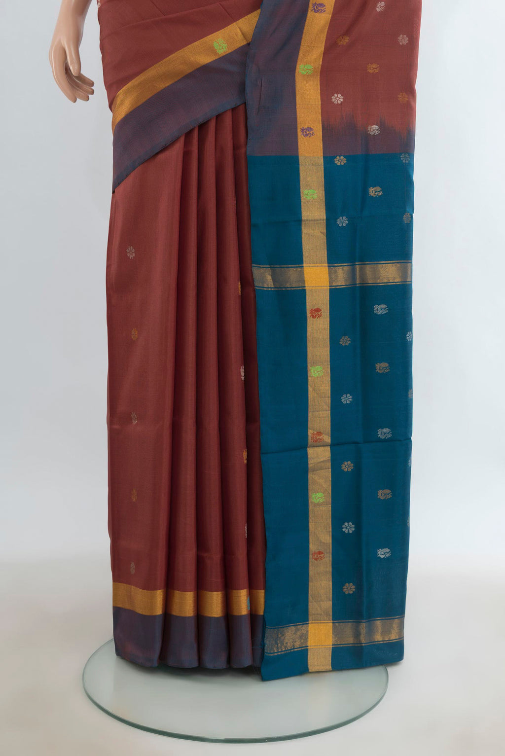 Pleats and pallu of Pure Silk Brown Uppada Saree with Zari Butta on the body and Zari Border. 