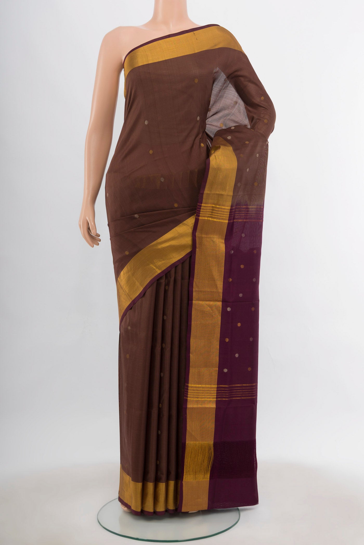 Coffee Brown Uppada Silk Saree with Zari Butta on the body and Silk Border.  displayed on a mannequin