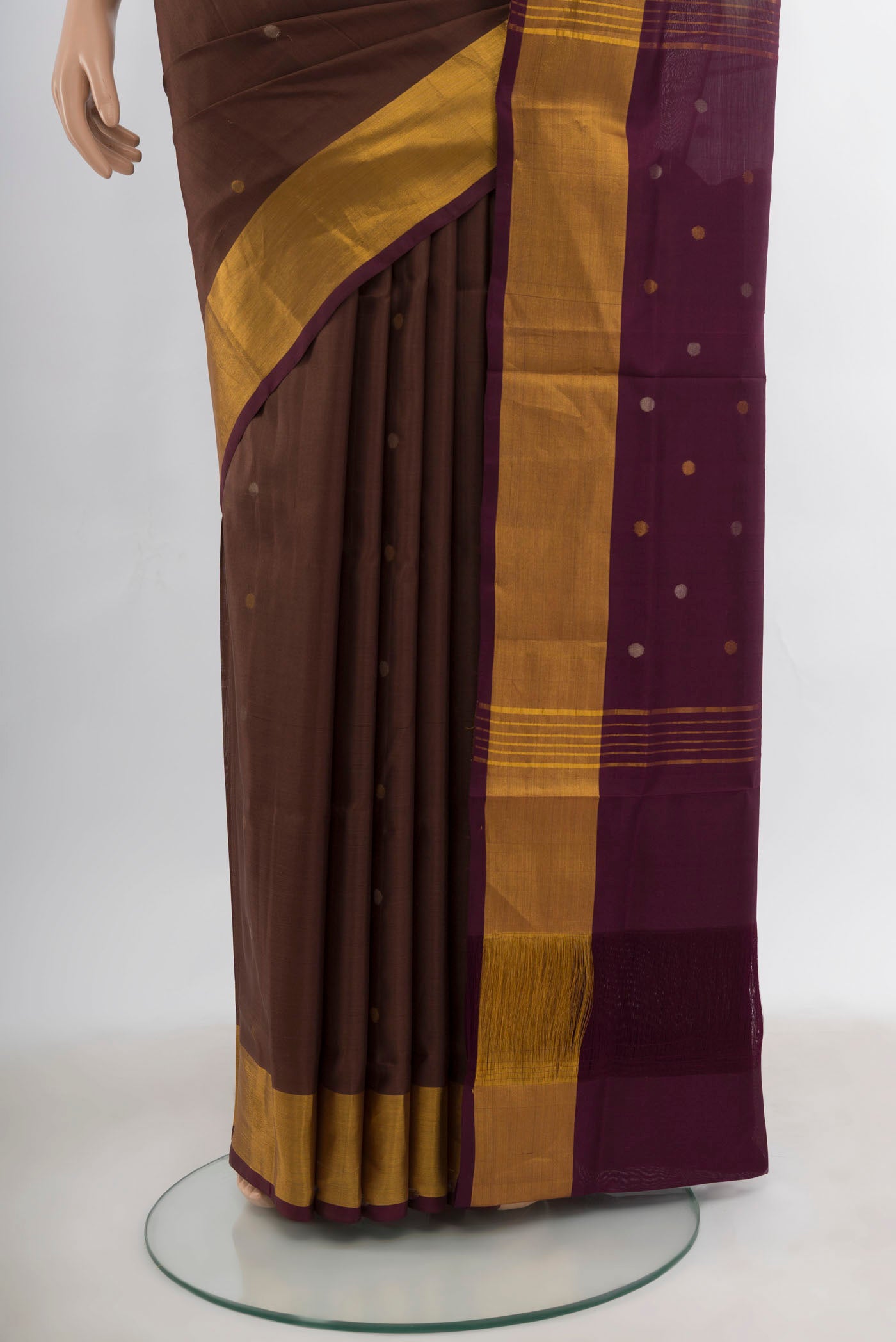 Pleats and pallu of Coffee Brown Uppada Silk Saree with Zari Butta on the body and Silk Border. 