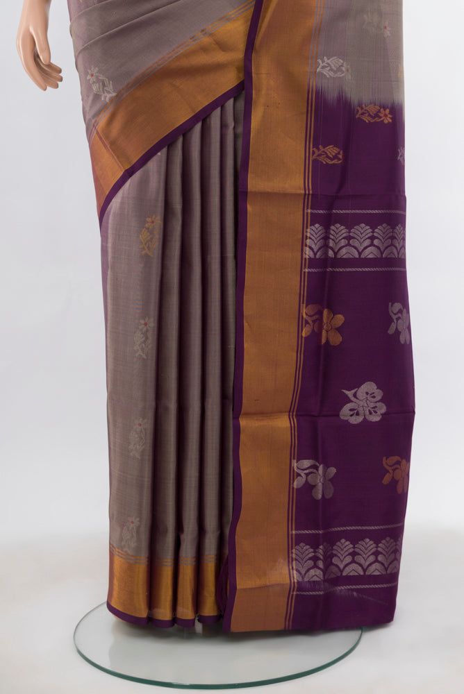 Pleats and pallu of Bronze Uppada Silk Saree with Zari Butta on the body and Silk Border. 