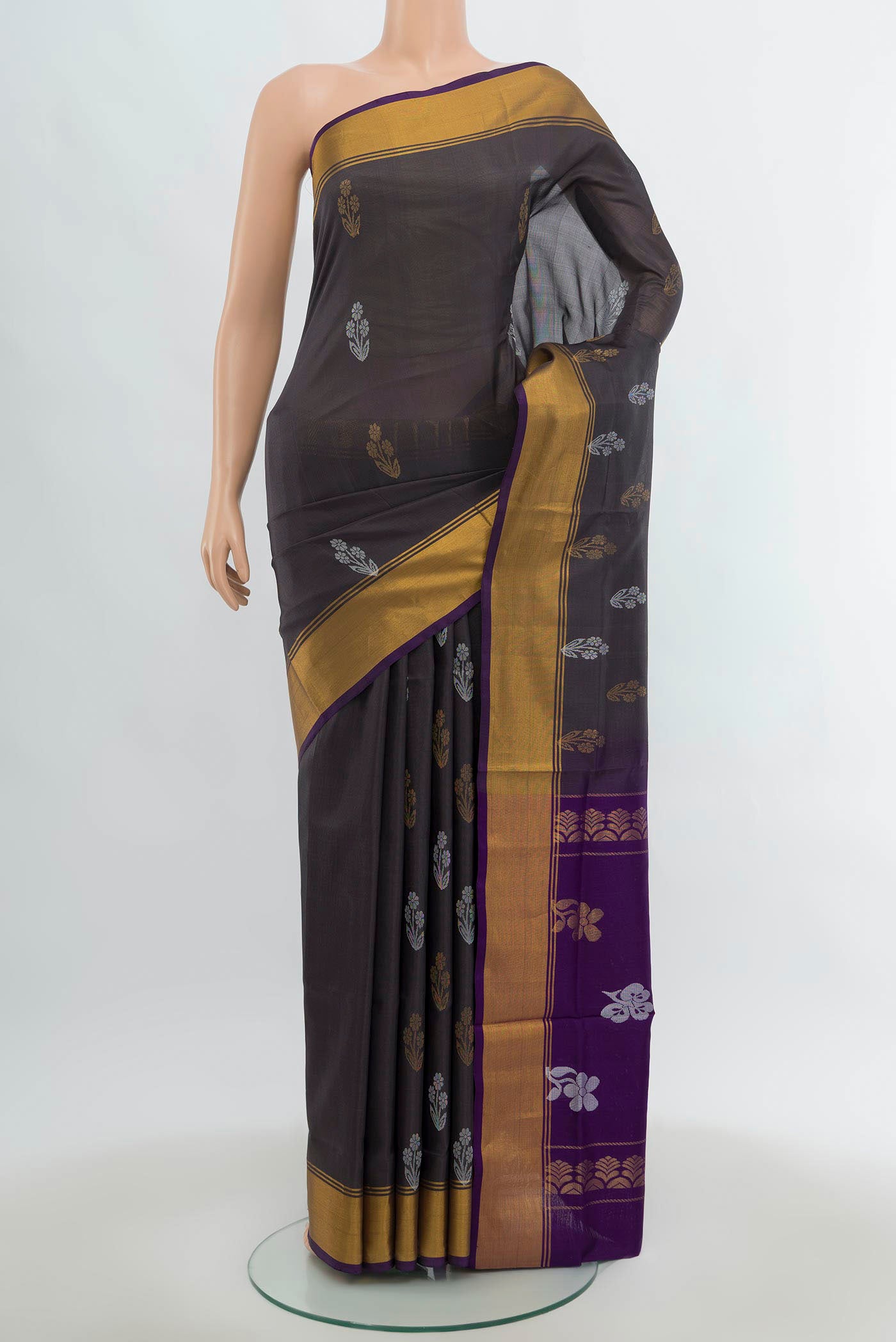 Grey Uppada Silk Saree with Zari Butta on the body and Silk Border.  displayed on a mannequin