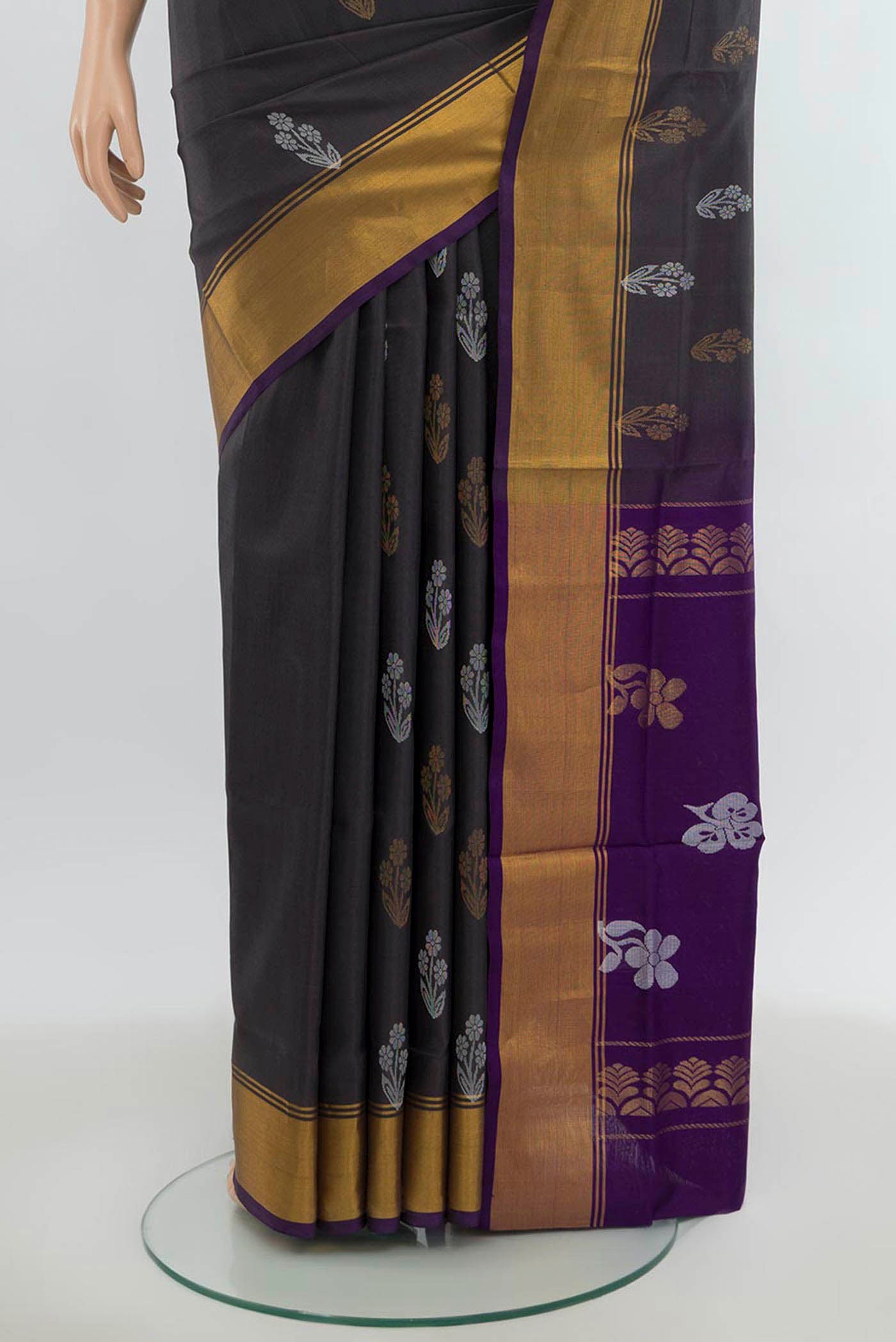 Pleats and pallu of Grey Uppada Silk Saree with Zari Butta on the body and Silk Border. 