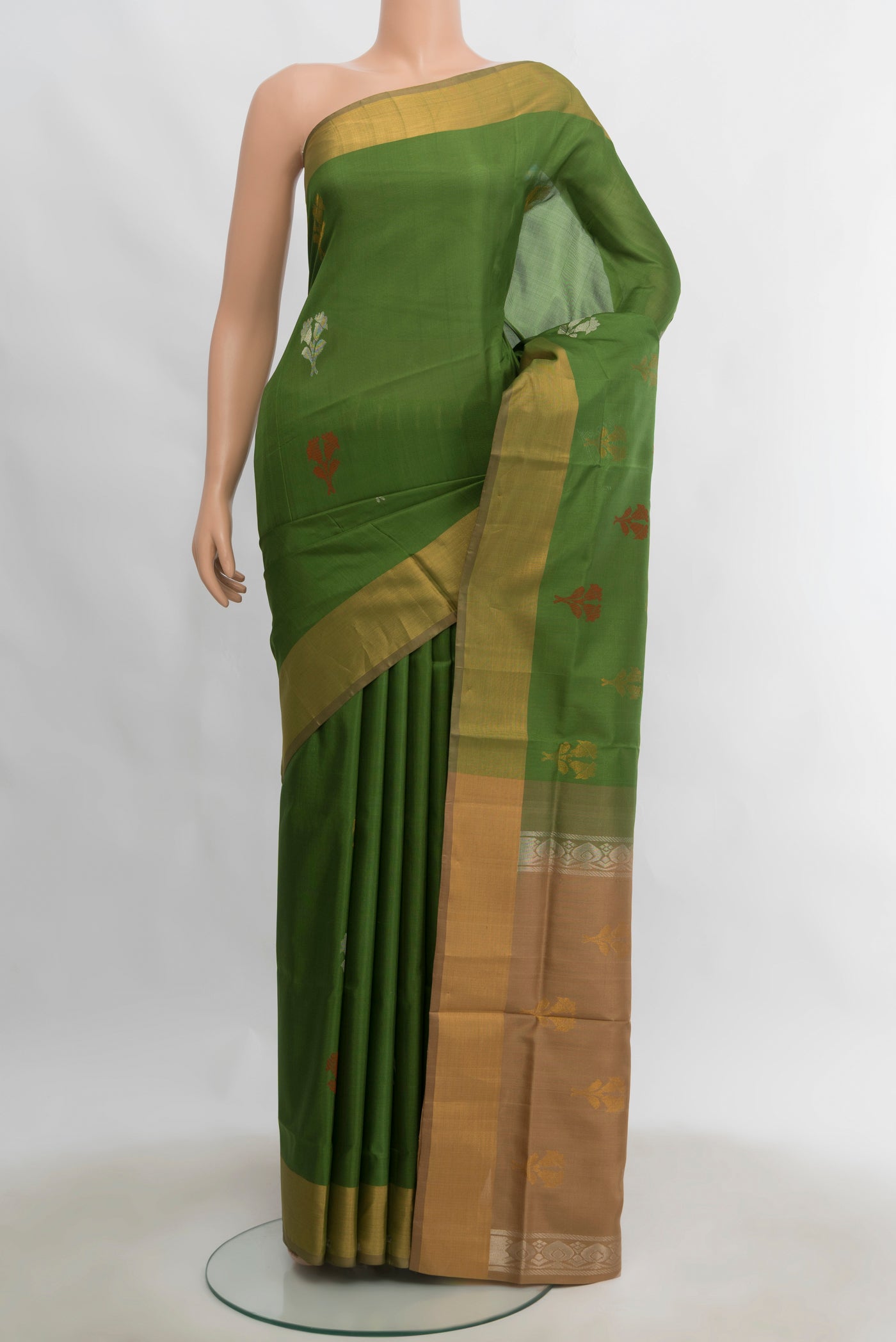 Light Green Uppada Silk Saree with Zari Butta on the body and Silk Border.  displayed on a mannequin
