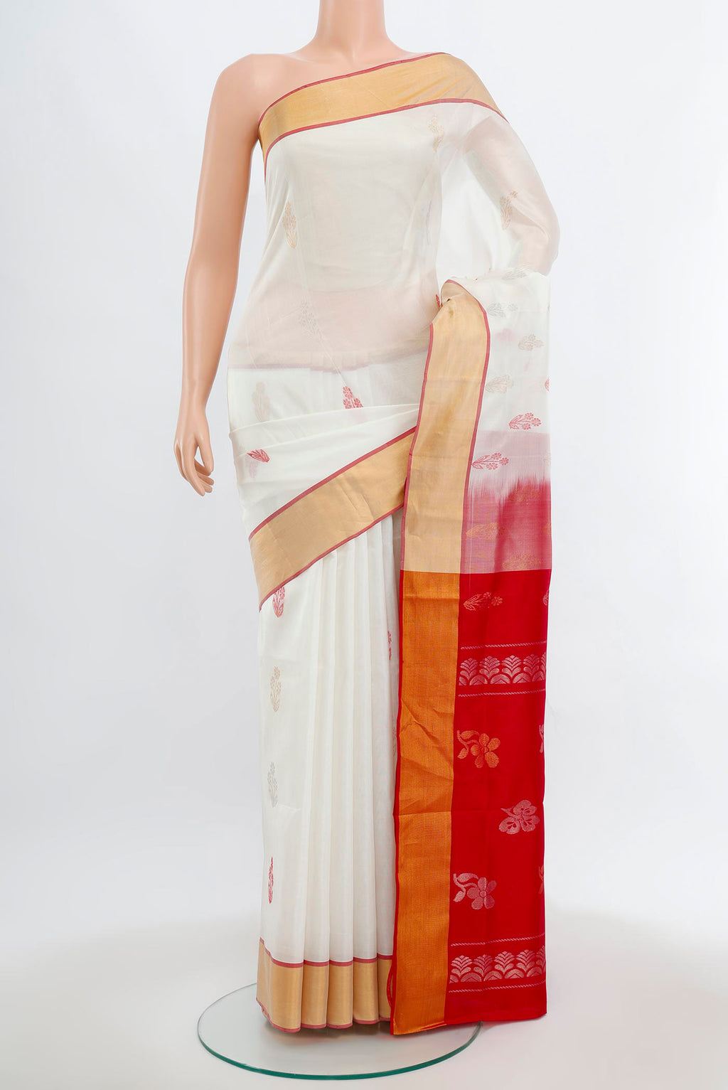 Off White Uppada Silk Saree with Zari Butta on the body and Silk Border.  displayed on a mannequin