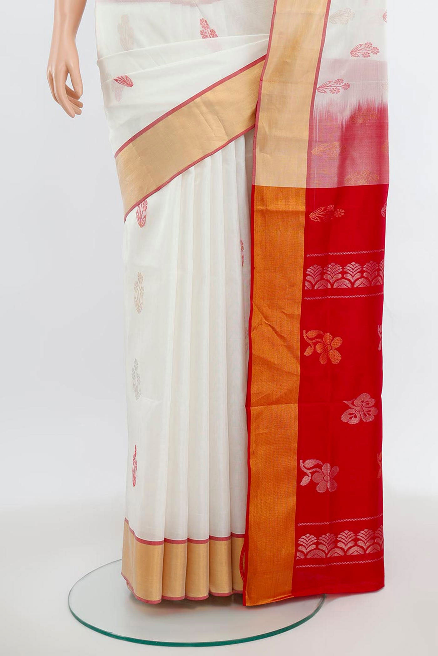 Pleats and pallu of Off White Uppada Silk Saree with Zari Butta on the body and Silk Border. 