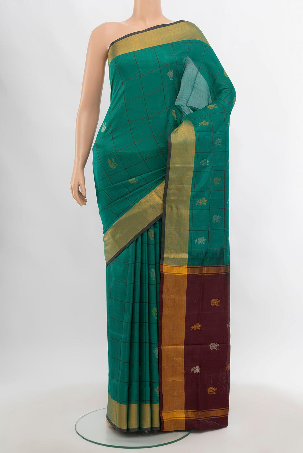 Pure Silk Pure Zari Peacock Blue Uppada Saree with Zari Butta on the body and Silk Border.  displayed on a mannequin