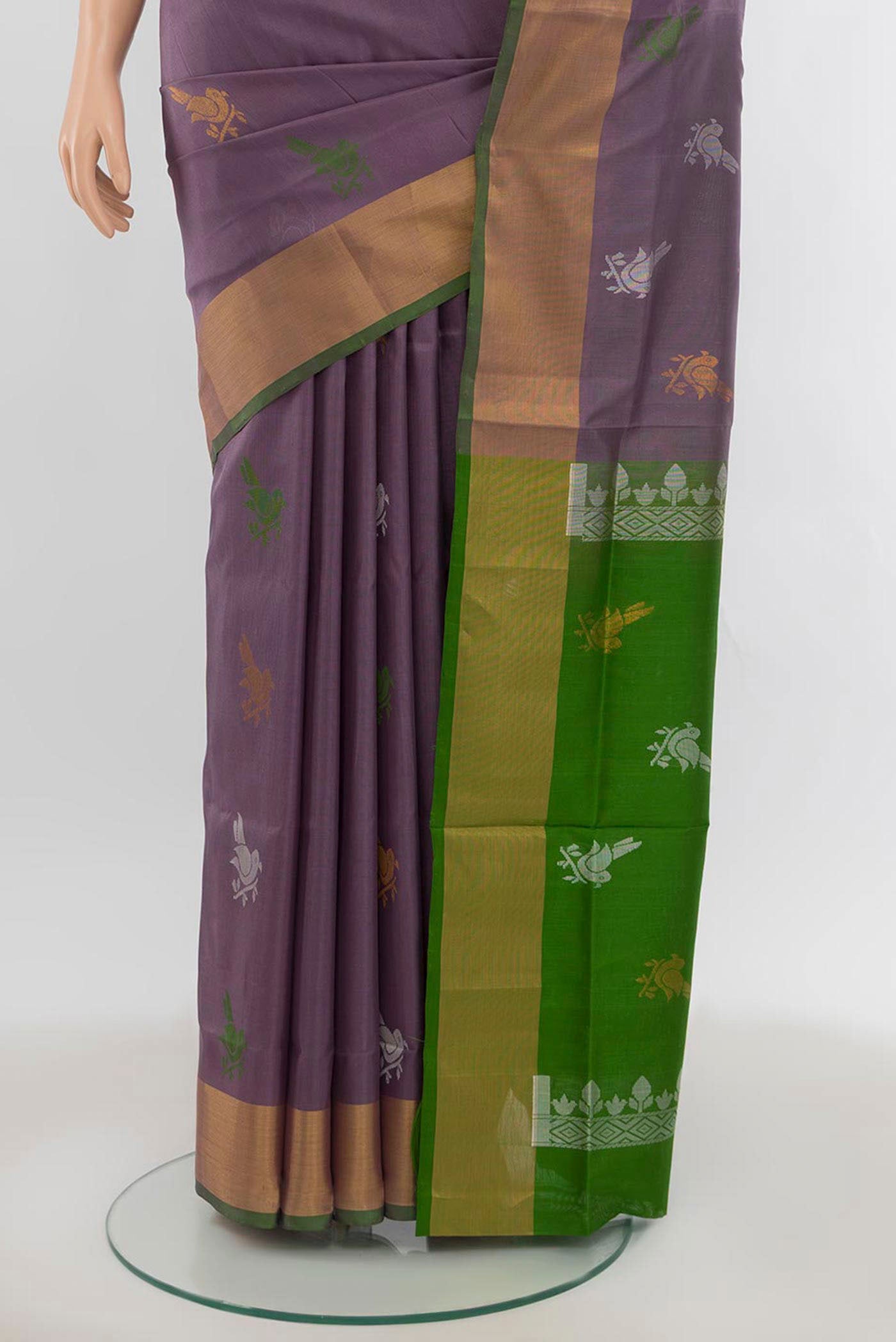 Pleats and pallu of Saffron Uppada Silk Saree with Zari Butta on the body and Silk Border. 
