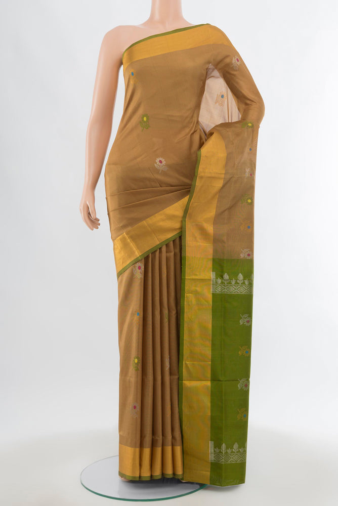 Beige Uppada Silk Saree with Zari Butta on the body and Silk Border.  displayed on a mannequin