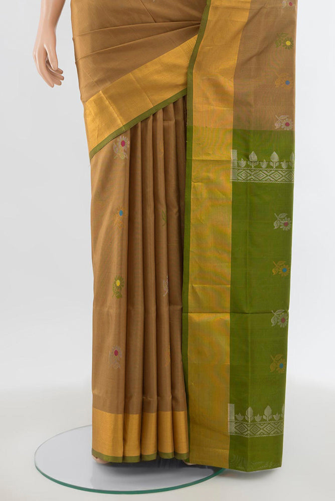 Pleats and pallu of Beige Uppada Silk Saree with Zari Butta on the body and Silk Border. 
