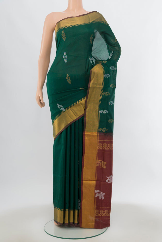 Mint Green Uppada Silk Saree with Zari Butta on the body and Silk Border.  displayed on a mannequin