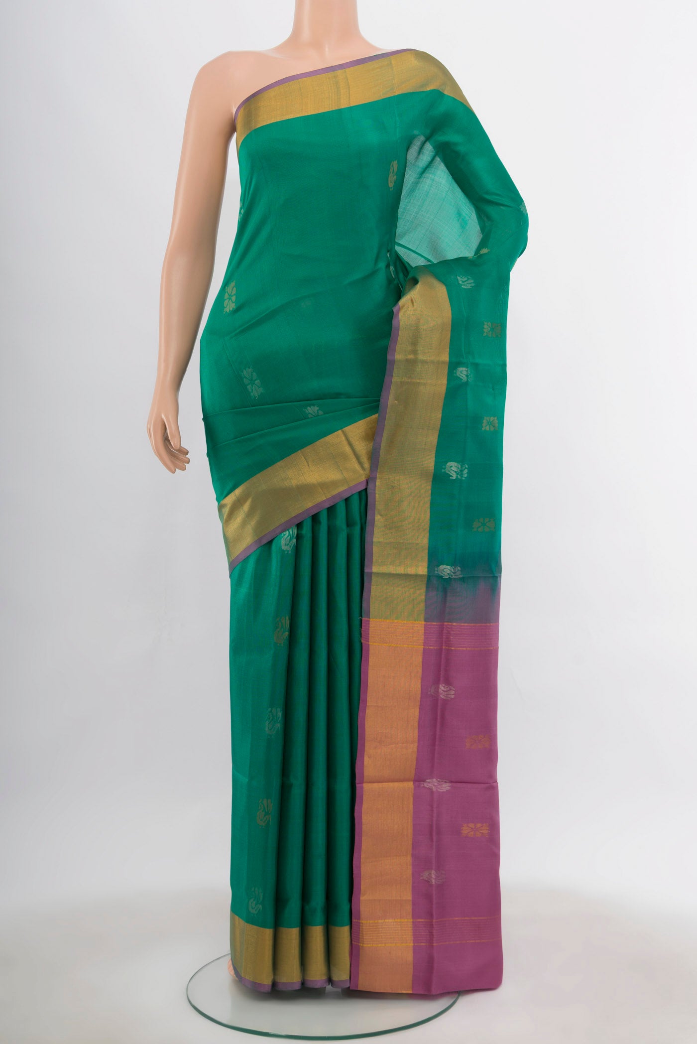 Peacock Blue Uppada Silk Saree with Zari Butta on the body and Silk Border.  displayed on a mannequin