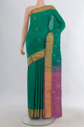 Pure Silk Green Uppada Saree with Zari Butta on the body and Zari Border.  displayed on a mannequin