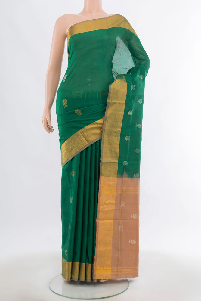 Mint Green Uppada Silk Saree with Zari Butta on the body and Silk Border.  displayed on a mannequin