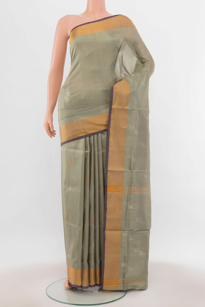 Davys Grey Uppada Silk Saree with Zari Butta on the body and Silk Border.  displayed on a mannequin