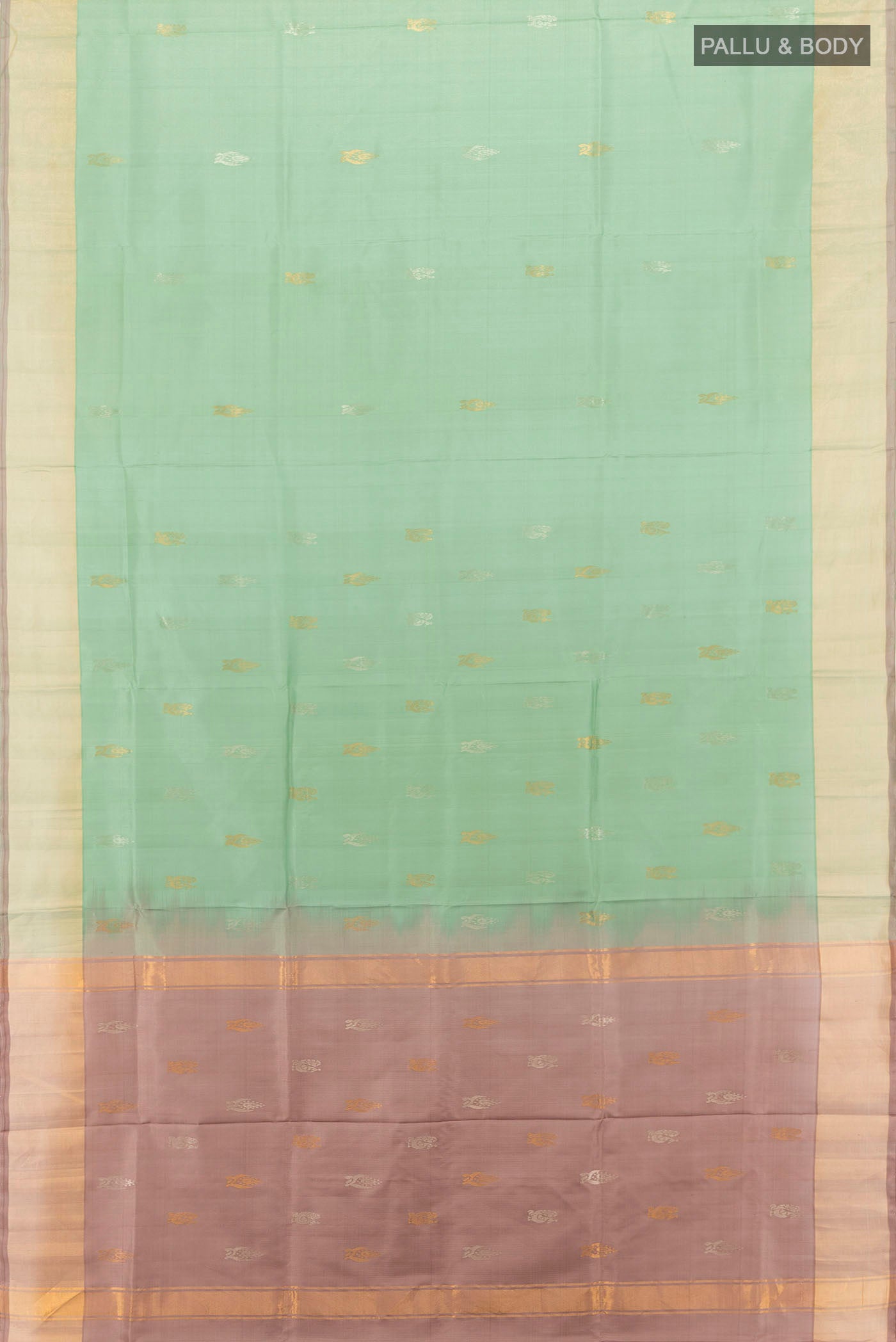 Flat view of Pista Green Uppada Silk Saree with Zari Butta on the body and Zari Border. 