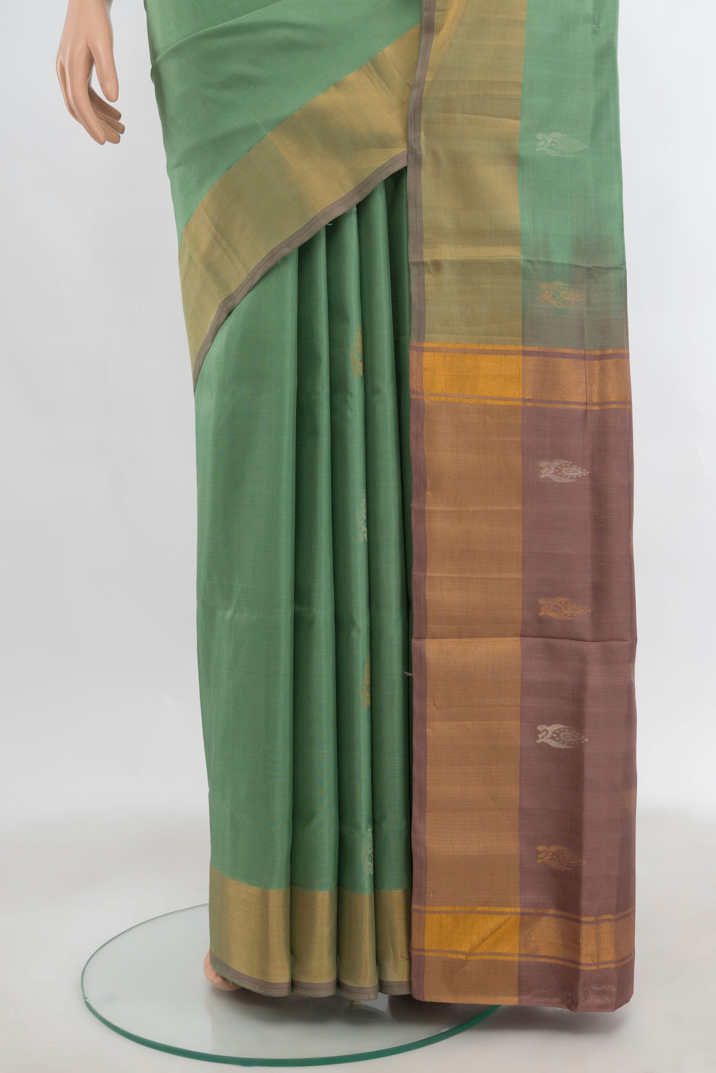 Pleats and pallu of Pista Green Uppada Silk Saree with Zari Butta on the body and Zari Border. 