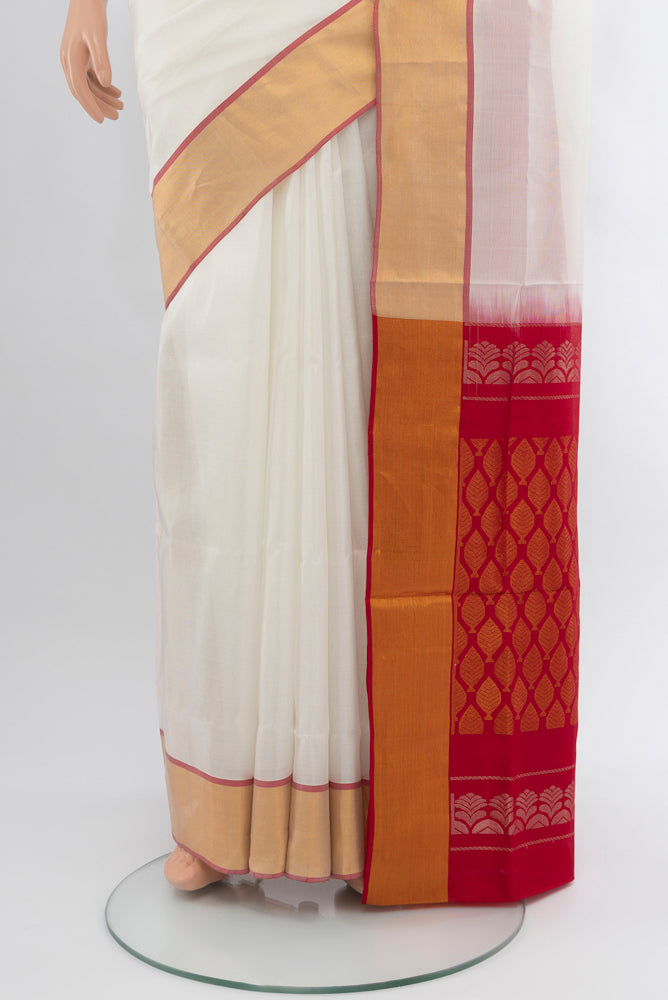 Pleats and pallu of Off White Uppada Silk Saree with Zari Butta on the body and Silk Border. 