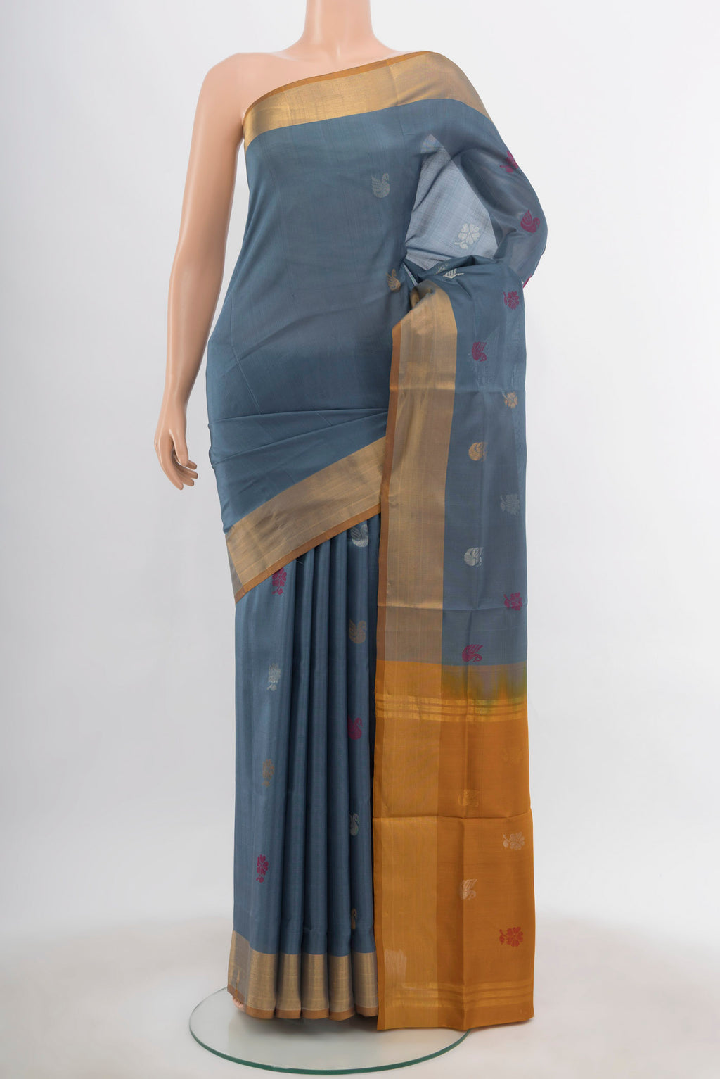 Grey Uppada Silk Saree with Zari Butta on the body and Silk Border.  displayed on a mannequin
