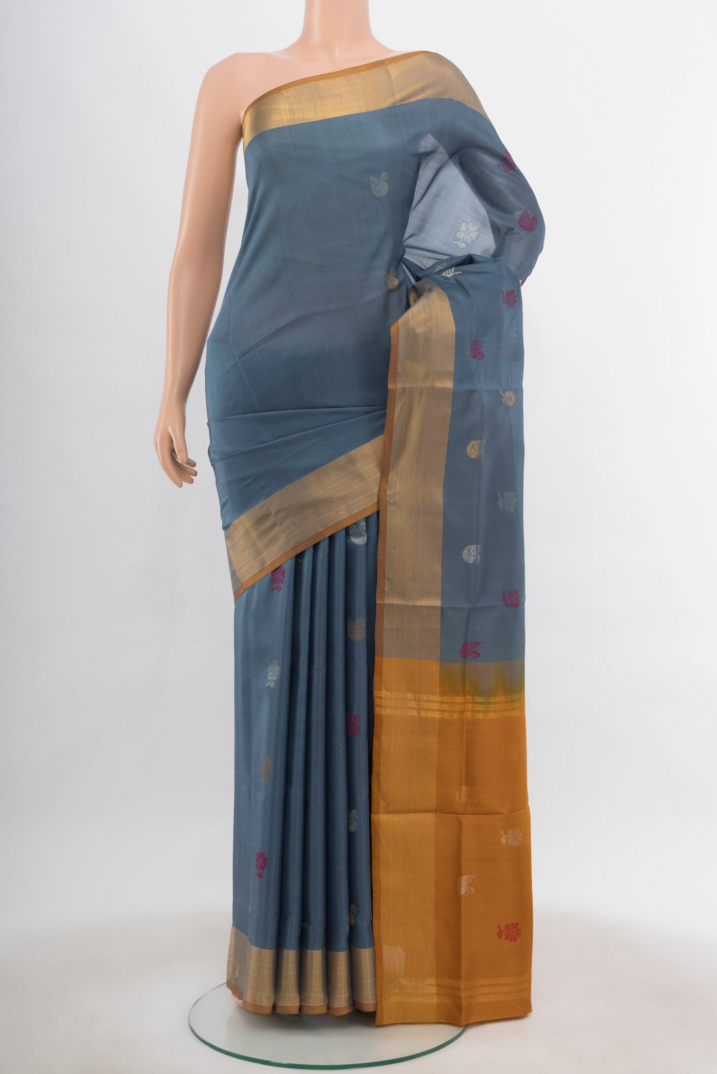 Grey Uppada Silk Saree with Zari Butta on the body and Silk Border.  displayed on a mannequin