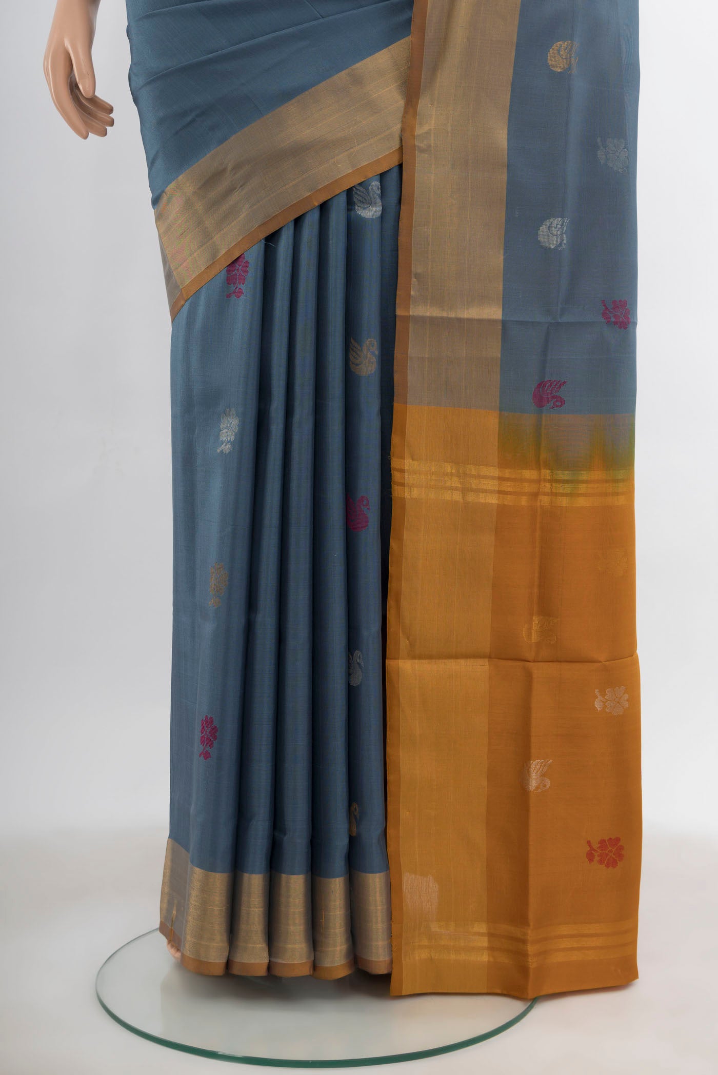 Pleats and pallu of Grey Uppada Silk Saree with Zari Butta on the body and Silk Border. 