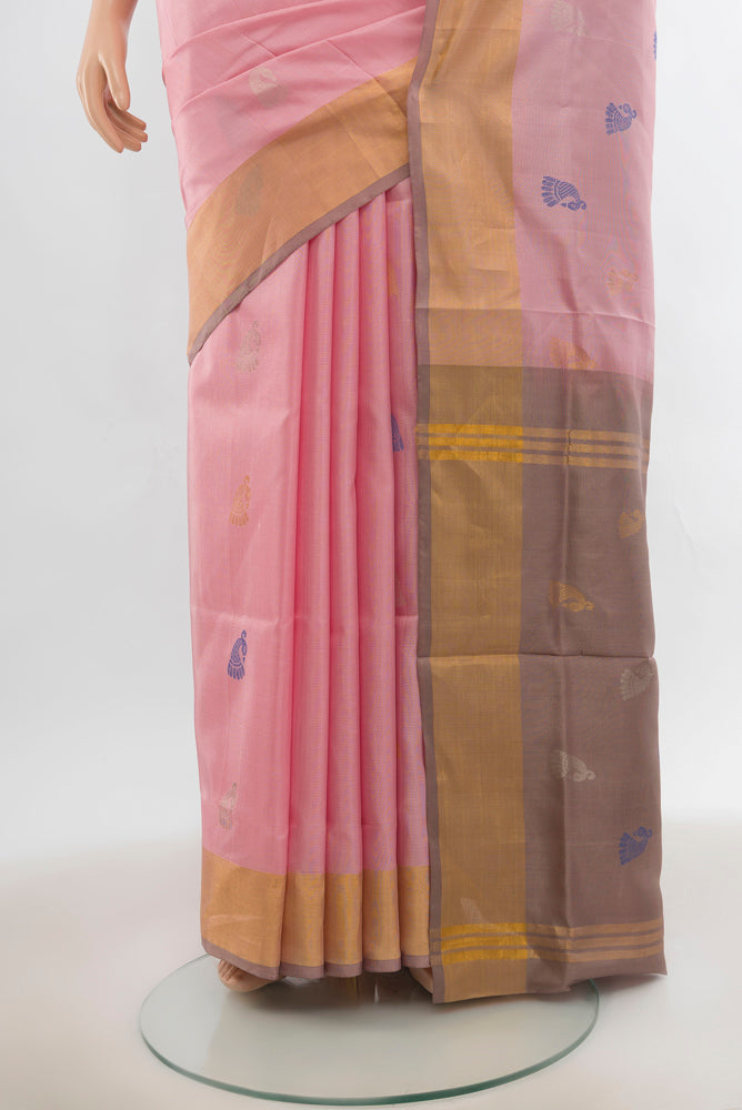 Pleats and pallu of Rose pink Uppada Silk Saree with Zari Butta on the body and Silk Border. 