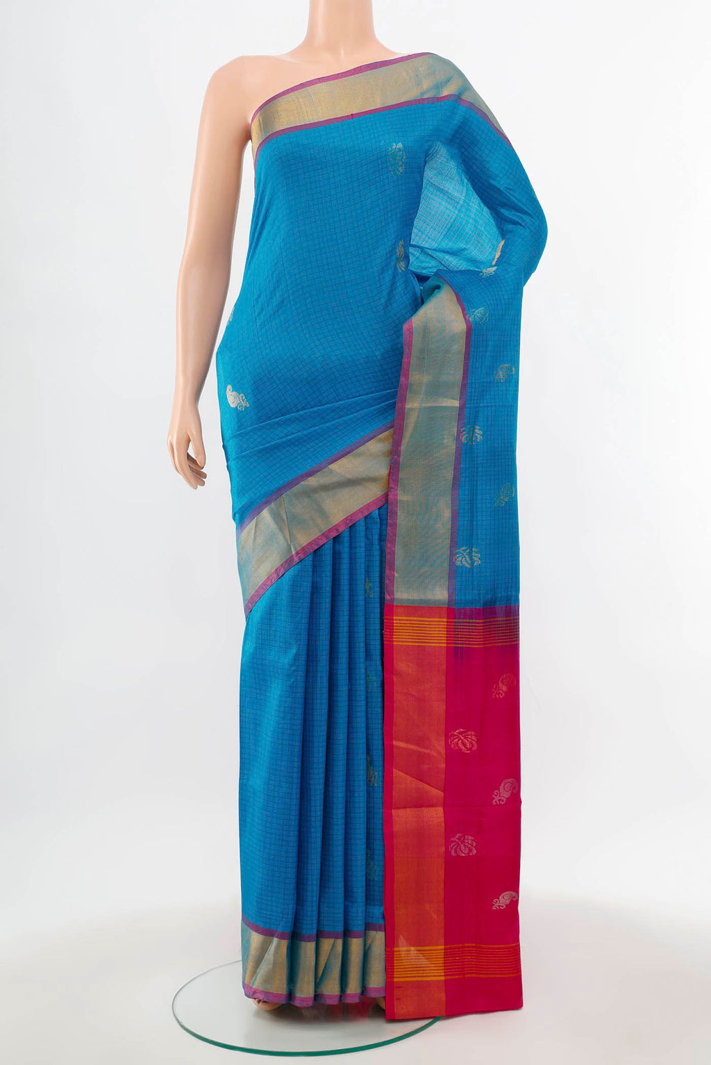 Light Blue Uppada Silk Saree with Zari Butta on the body and Silk Border.  displayed on a mannequin