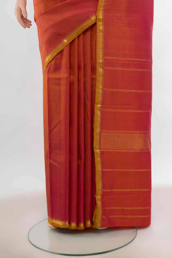 Pleats and pallu of Peach Kanjivaram Silk Saree with Zari Butta on the body and Silk Border. 