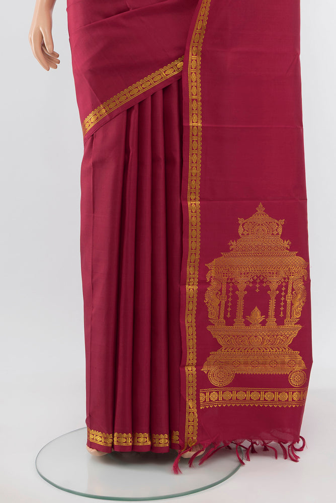 Pleats and pallu of Pure Silk Pure Zari Maroon Kanjivaram Saree with Zari Butta on the body and Silk Border. 
