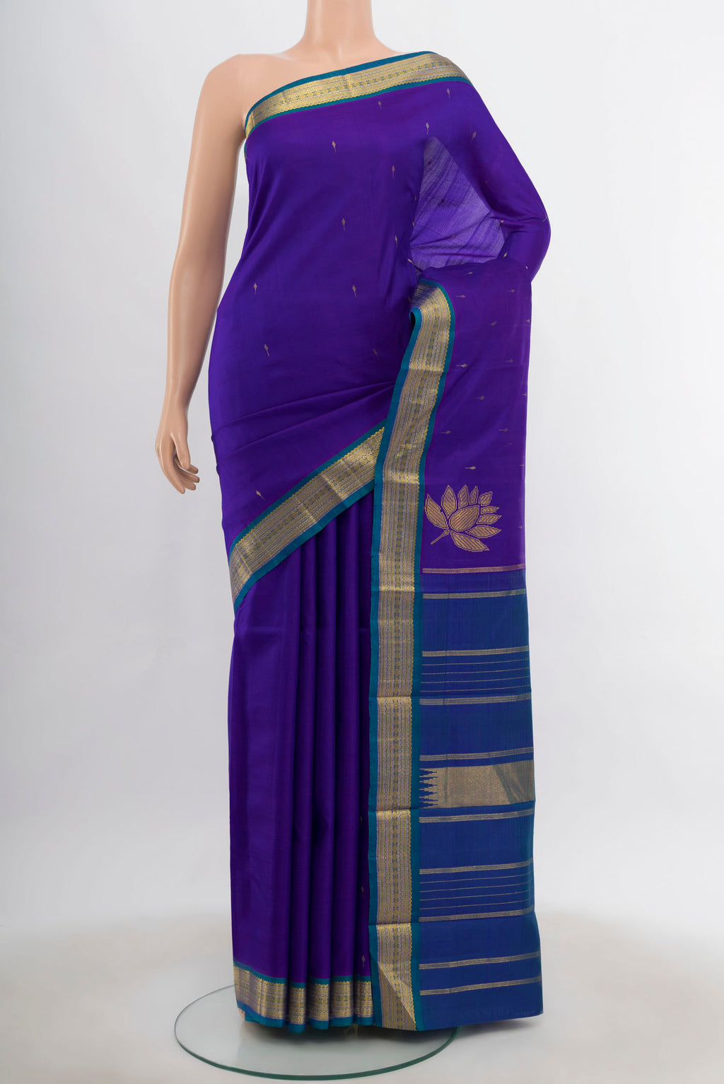 Dark Blue Kanchipuram Silk Saree with Zari Butta on the body and Silk Border.  displayed on a mannequin