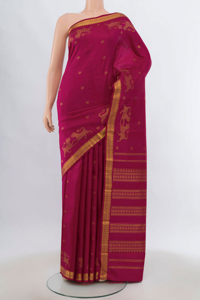 Dark Pink Kanjivaram Silk Saree with Zari Brocade on the body and Silk Border.  displayed on a mannequin