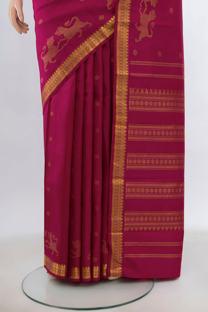 Pleats and pallu of Dark Pink Kanjivaram Silk Saree with Zari Brocade on the body and Silk Border. 